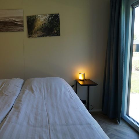 Lodge 4 personen - Dijk met Hottub & Sauna