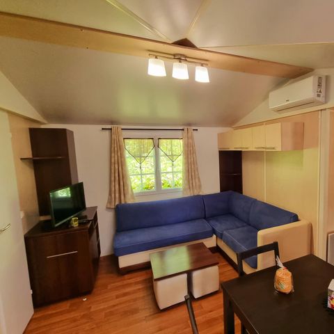 Stacaravan 6 personen - Premium 22-28m² - 2 kamers + TV + Overdekt terras & Bedlinnenpakket aanwezig